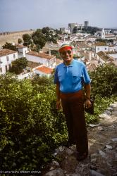 (39566_sl-3.jpg) Lama Yeshe in street clothes, rainbow visor, Lisbon, Portugal, 1983.