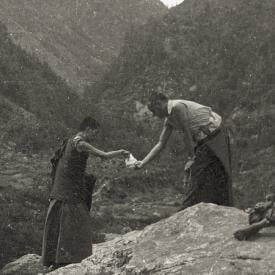 Lama offering Rinpoche candy, leaving Namche Bazaar on the way to Lawudo, 1973. Photo: Nick Ribush
